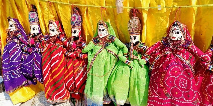 Shop for unique souvenirs at the lively Dilli Haat on your trip to the capital city of India.
