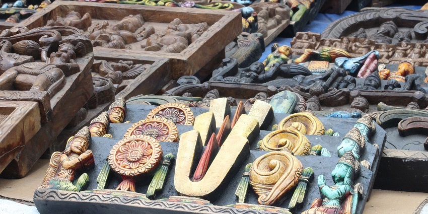 A glimpse of colourful handicrafts being sold at Dilli Haat, a traditional village fair setup.