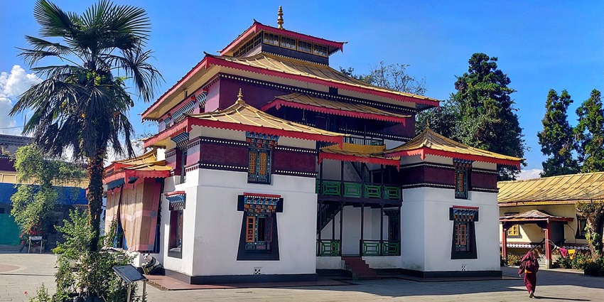 A picture of a traditionally built monastery in Dibrugarh with vibrant corridors and artefacts