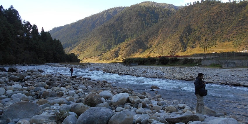 A scenic view of the glistening Dirang River, an idyllic spot near Dirang Monastery.