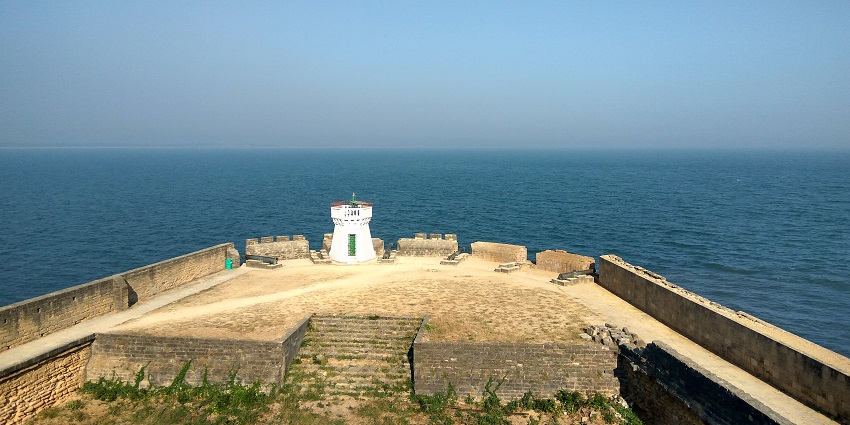A scenic view of the vast ocean from the top of the Diu Fort, a famous tourist spot.