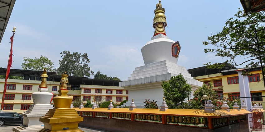 View of the Do Drul Chorten Stupa with the clear blue sky in the background.