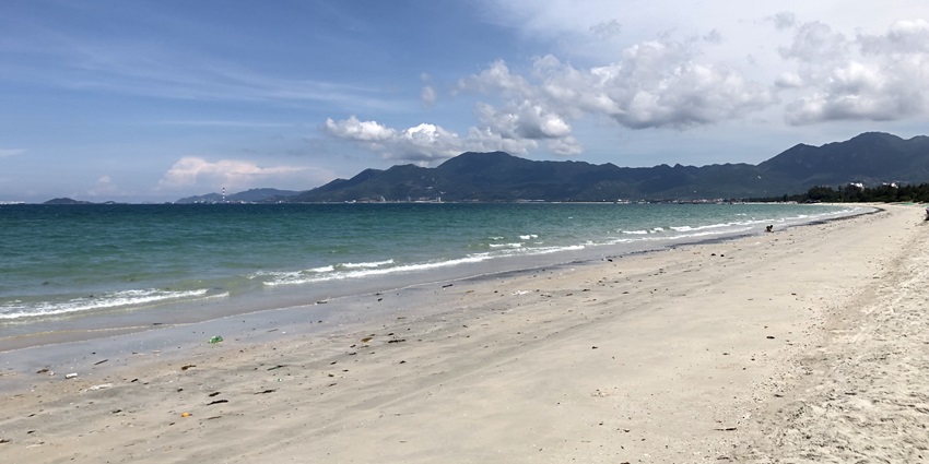 A scenic view of cobalt blue waters meeting the golden sands of Doc Let in the region.