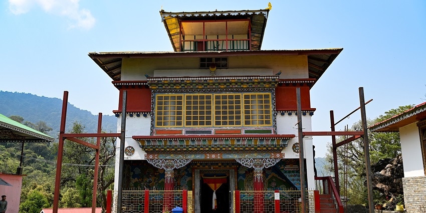 The frontal view of a monastery with traditional Buddhist-style architecture