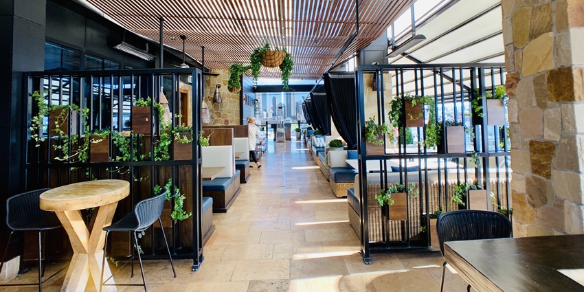 A picture of the interiors of a rooftop bar in Bali with a grand party ambience
