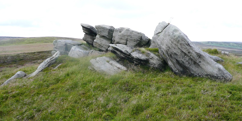 Northern view of the Dove Stones in Trawden Forest, featuring rugged moorland terrain.