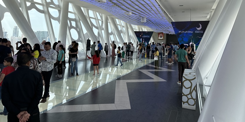 A picture of the Dubai Frame observation desk with people enjoying the serene views