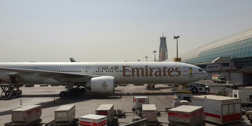 An image of an Emirates Boeing 777 in Park Position in one of the airports in Dubai.