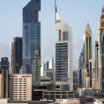 A picture of office towers and skyscrapers in Dubai during a bright sunny day