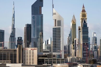 A picture of office towers and skyscrapers in Dubai during a bright sunny day