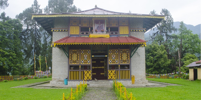 Dubdi monastery, with worn exterior and detailed wood carvings, links tourists to Sikkim’s Buddhism.