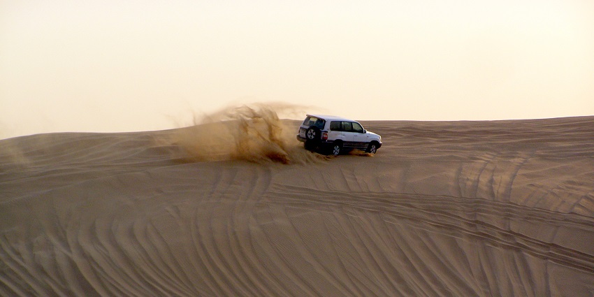 Dune bashing includes navigating the towering sand dunes in majestic four wheelers.