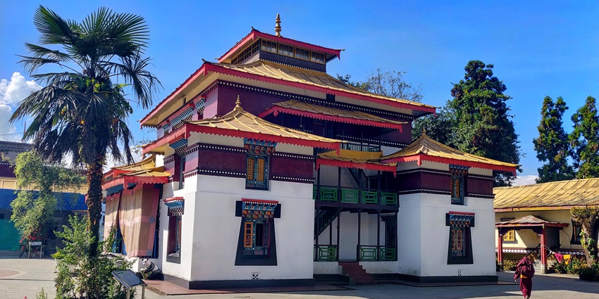 A front view of the iconic Enchey Monastery, adorned with beautiful, vibrant shades.