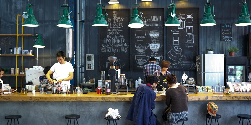 A picture of a bar counter at a pub in Hauz Khas with a variety of drinks on display