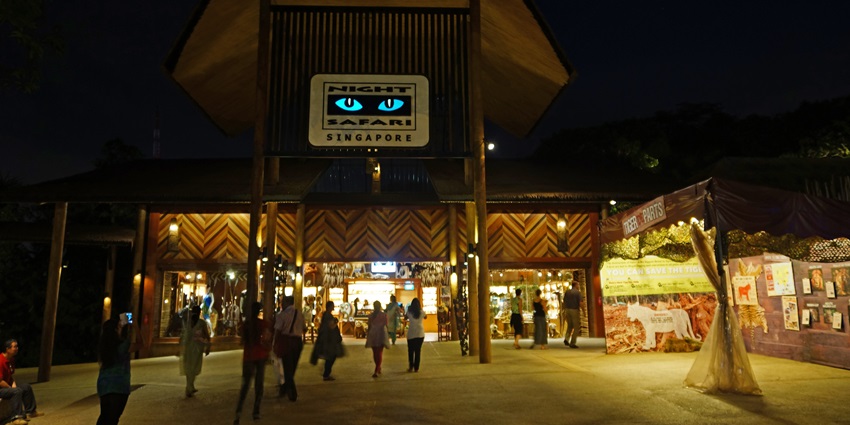 Entrance of Night Safari, Singapore, featuring an inviting archway with lush greenery.