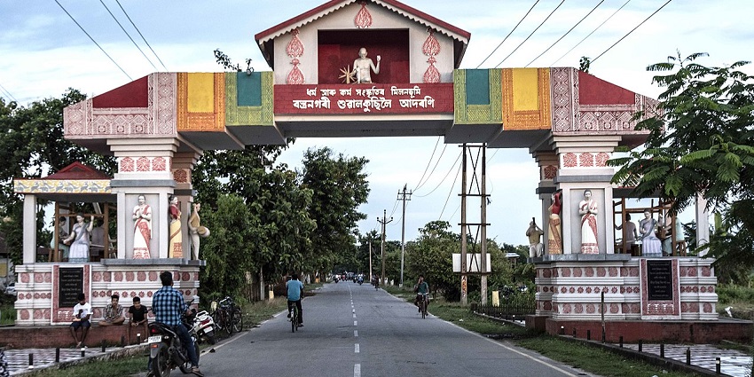 Weaving Village Sualkuchi with traditional design elements and a welcome sign.