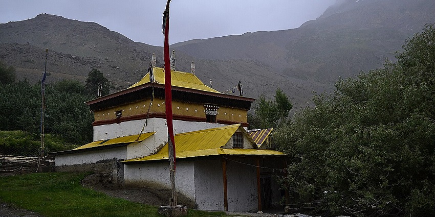 Ancient Buddhist monastery with vibrant murals, prayer flags, and peaceful setting amid Spiti’s remote terrain, one of the best things to do in Spiti Valley.