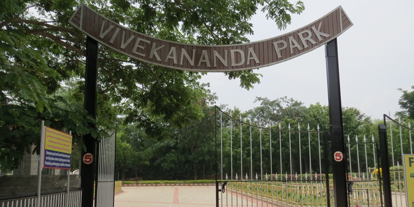 Entrance of vivekanada park at, surrounded by lush trees and Garden