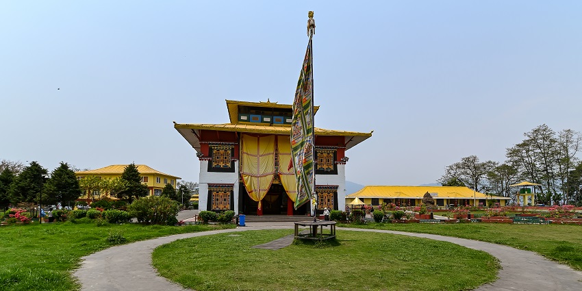 Tsuglakhang Monastery & Temple is located amidst the hills of the Dhauladhar range, with serene surroundings.