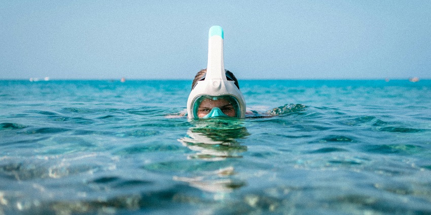 A man clicked right when he was coming out of the water with his snorkelling gear on