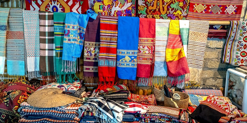 Image of Vibrant Handmade Textile Display at Local Market - one of the best places for shopping in Srinagar