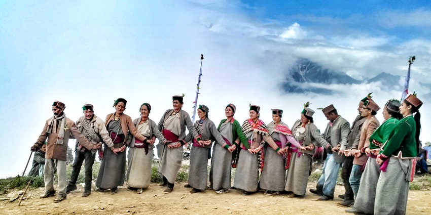 View of a group of people performing the traditional dance of Himachal Pradesh in Kinnaur.