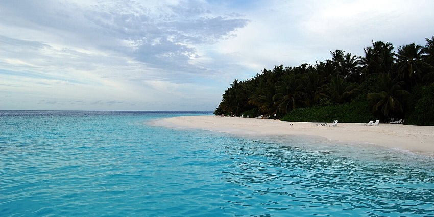 Beautiful views of the clear sky and ocean from the beach–Places to visit in Maldives