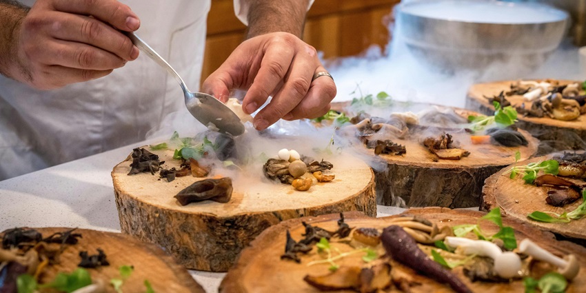 A picture of a chef preparing a delectable meal at a fine-dine restaurant in Sri Lanka