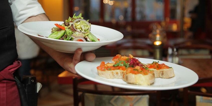 Image of the mouthwatering food being served in the beautiful ceramic plates.