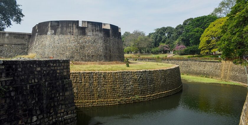 A historic view of Palakkad Fort, showcasing its impressive architecture and lush surroundings.