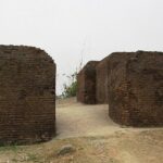 Ruins of an ancient fort with crumbling walls, and a sense of historical grandeur.