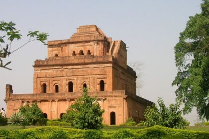 Historic Badarpur Fort, surrounded by lush greenery and ancient architectural elements.