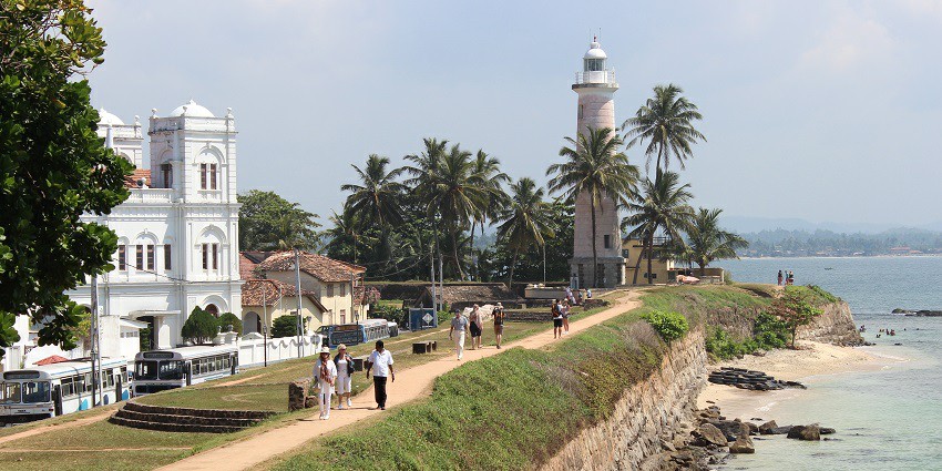 A mesmerising view of the Galle Fort, a famous tourist attraction, and the vast ocean.