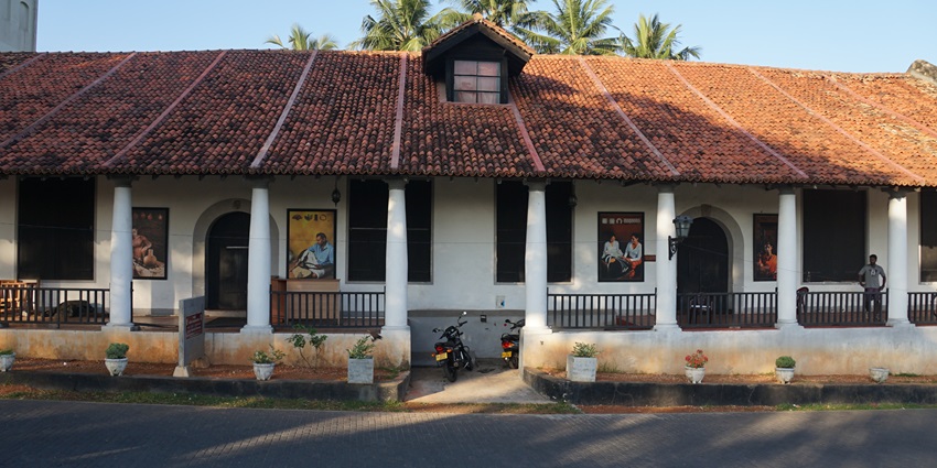 Historic Galle National Museum with white colonial architecture and arched windows.