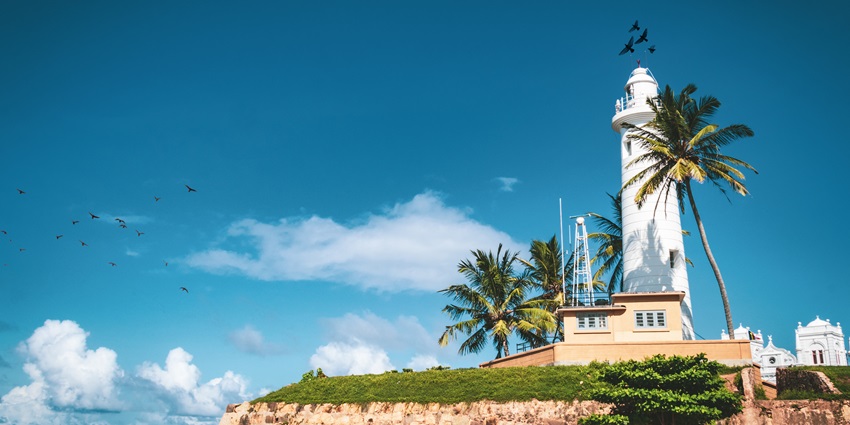 A beautiful view of the famous lighthouse elegantly nestled in the region of Galle.