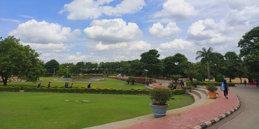 An idyllic view of Gandhibag Park, featuring well-manicured, lush green lawns.