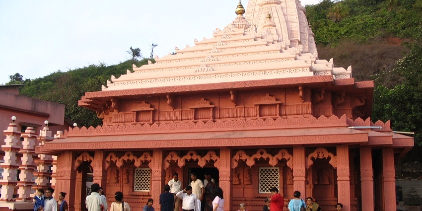 A view of people visiting a famous holy shrine to seek blessings with loved ones.