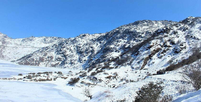 A breathtaking vista of majestic mountains covered in pristine white snow in the region.