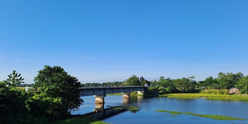 Ghat of Majuli with clear water leading down to the river - Places to visit in Golaghat.