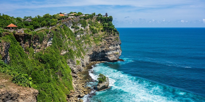 A tall and elevated island in Indonesia with green environment and resorts along with a sea view