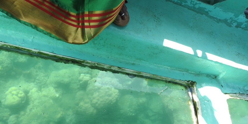 A glass bottom boat ride is among the adventurous things to do in Maldives with family.