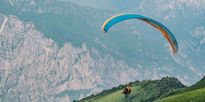 Soaring through the sky with expansive landscapes and stunning views below.