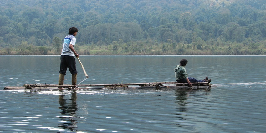 Glow lake is present in the surroundings of lush green forests and high peaks