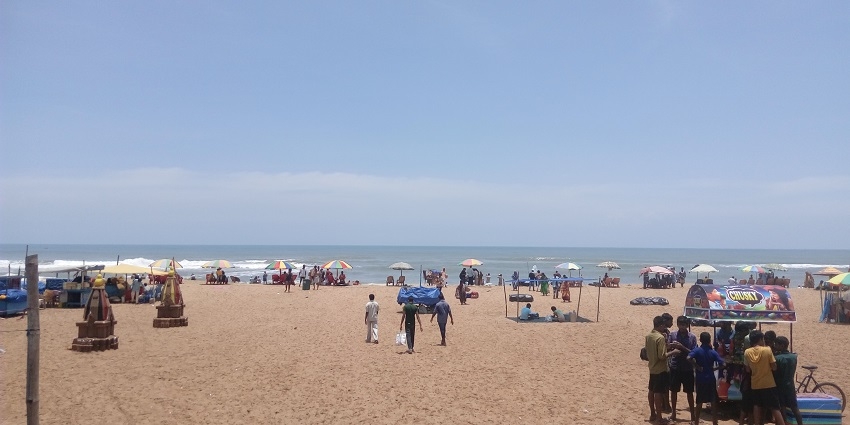 A picturesque view of the golden shores and glistening waters of the Golden Beach.
