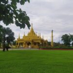 Picturesque view of Golden Pagoda, gleaming against the sky - places to visit in Namsai