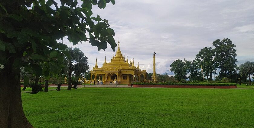 Picturesque view of Golden Pagoda, gleaming against the sky - places to visit in Namsai