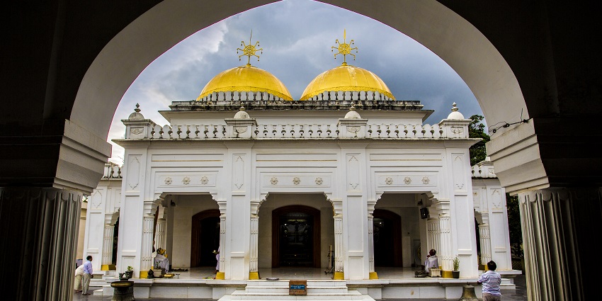 Shree Govindajee Temple's majestic facade with golden domes and intricate carvings.