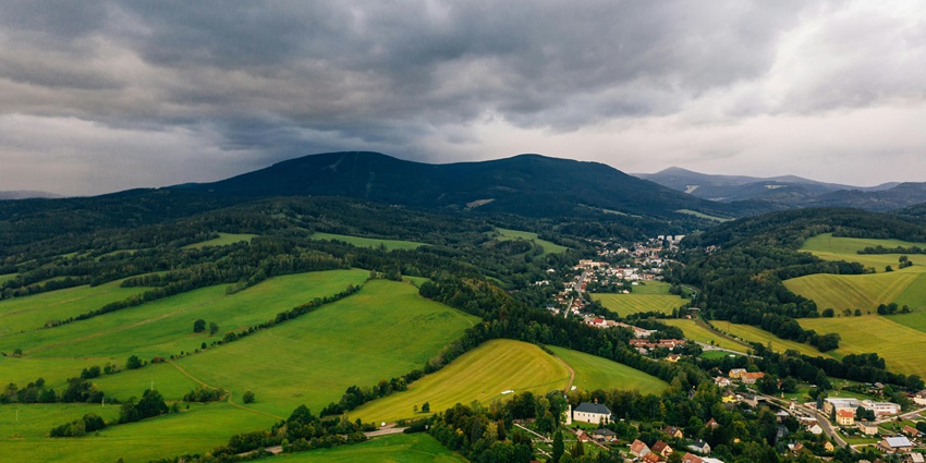 Lush green field and town - one of the best places to visit near Vantawng falls.