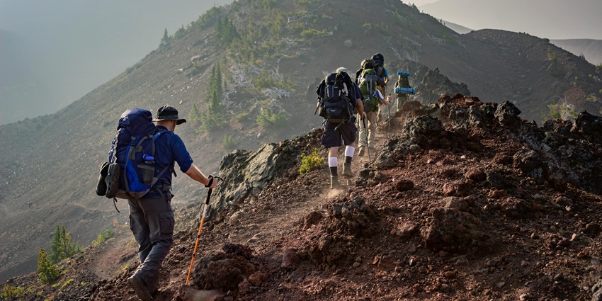 Group of Person Walking in Mountain - one can trek in Karol Tibba and explore in the nature