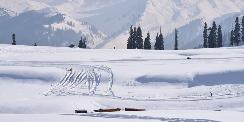 The snow-laden slopes of Gulmarg in winter provide an ideal terrain for snowboarding